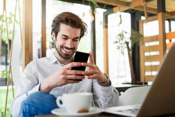 istock Young man texting in cafe place 1058346594