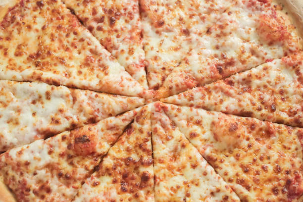 istock Delicious cheese sliced pizza 1058346954
