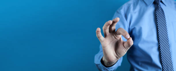 istock Successful businessman doing ok sign. 1058351368