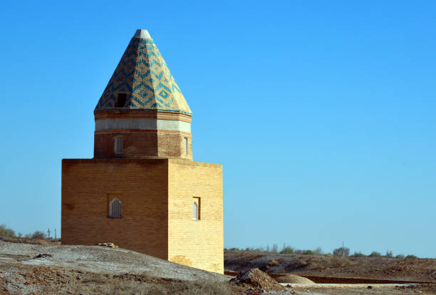 istock Konye-Urgench - Il Arslan Mausoleum, 12th century - conical dome, with a zigzag pattern - ruins of the capital of Khwarazm, part of the Achaemenid Empire, Turkmenistan 1058351798