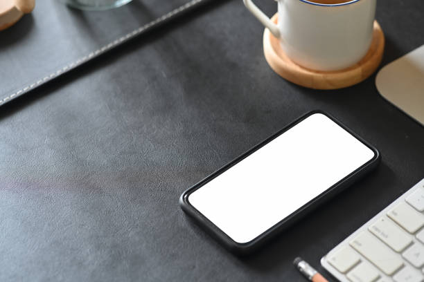 Mockup blank screen mobile phone on workspace desk.
