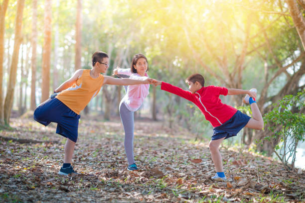 istock Family sport happy active mother and kids jogging outdoors running in forest 1058357708