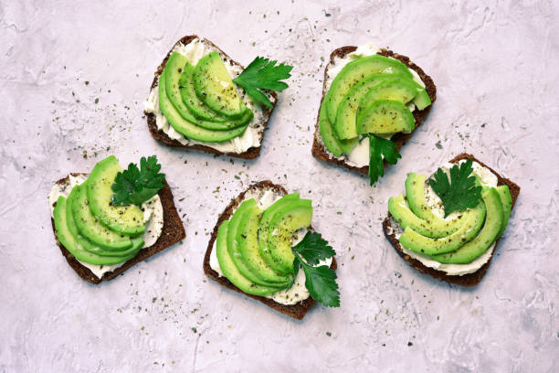 istock Rye avocado toasts with ricotta cheese 1058357976