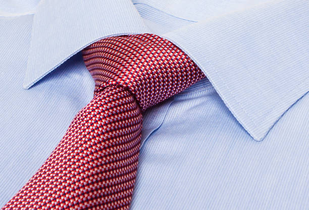 istock Colored silk tie and shirt on white background. 1058359306