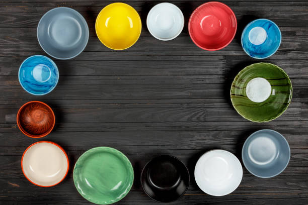 istock food, cooking, Multicolored bowls, utensils, concept, black table 1058360818