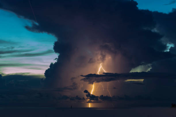 istock Lightning in the sea And big black clouds 1058360956