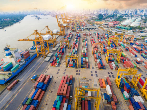 istock Container Cargo freight ship with working crane bridge in shipyard in singapore 1058362352