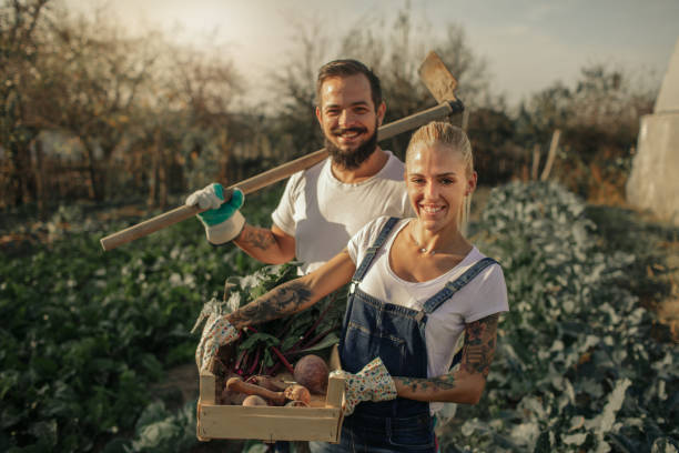 istock Tattooed Couple Farming Together 1058362386