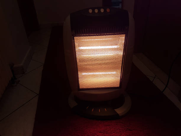 istock heater electric on the room carpet winter 1058368146