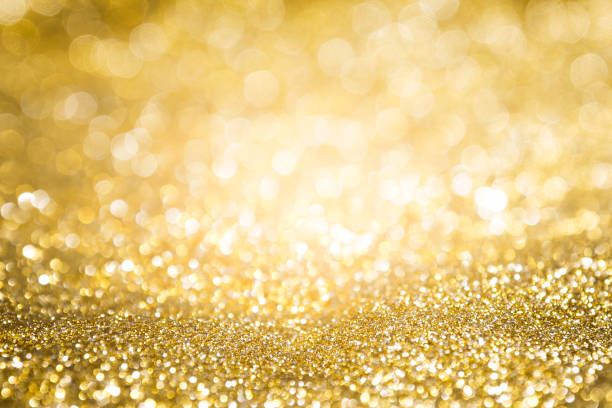 istock abstract background gold light bokeh christmas holiday 1058368424