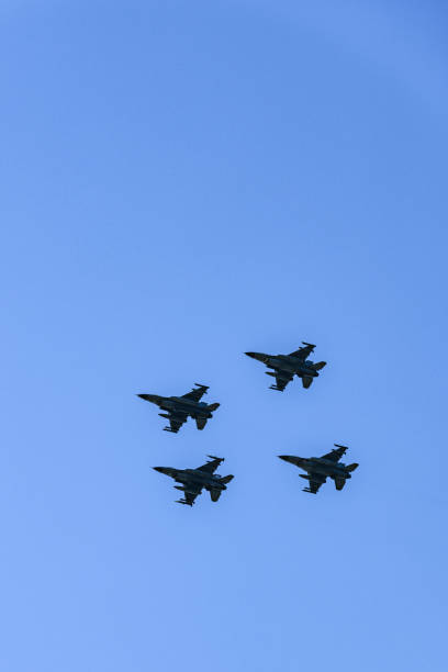 istock F-16 Fighting Falcon jets flying in formation in mid-air 1058369576