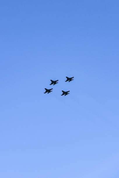 istock F-16 Fighting Falcon jets flying in formation in mid-air 1058369582