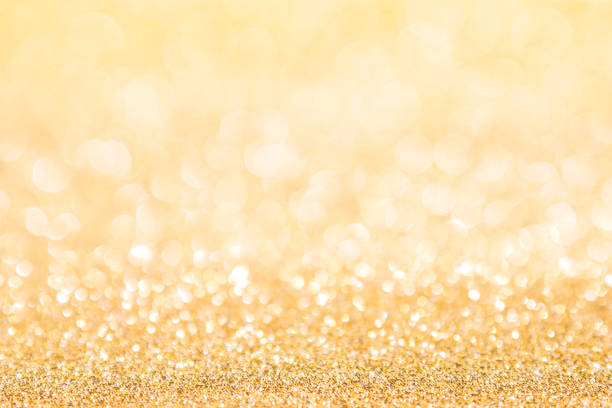 istock abstract background gold light bokeh christmas holiday 1058371012