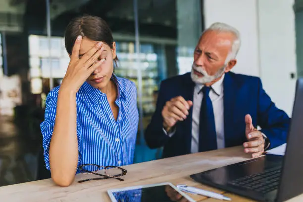 Photo of Colleagues arguing at workplace