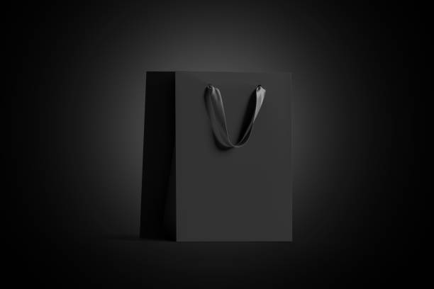 istock Blank black paper gift bag with silk handle mock up, 1058371920