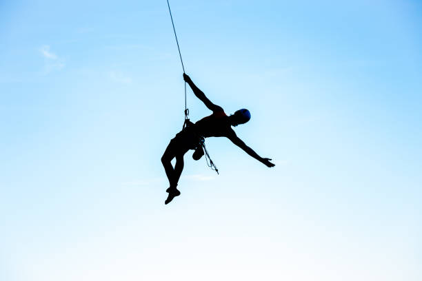 istock Man jumping with rope from mountain 1058371922
