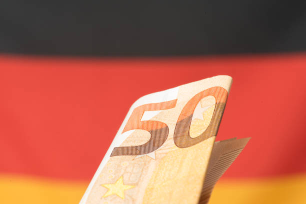 istock Flag of Germany and a euro banknote 1058372420