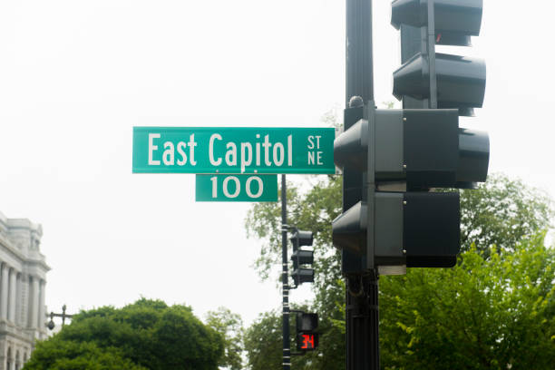 istock Road Sign Against Sky In City 1058382502