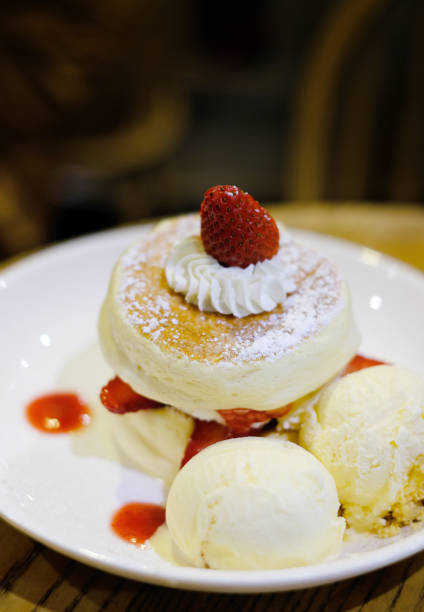 istock closeup fluffy pancake with fresh strawberry 1058389156