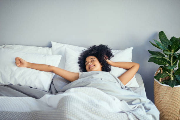 wakey, wakey sleeping beauty - wake up stretching women black imagens e fotografias de stock