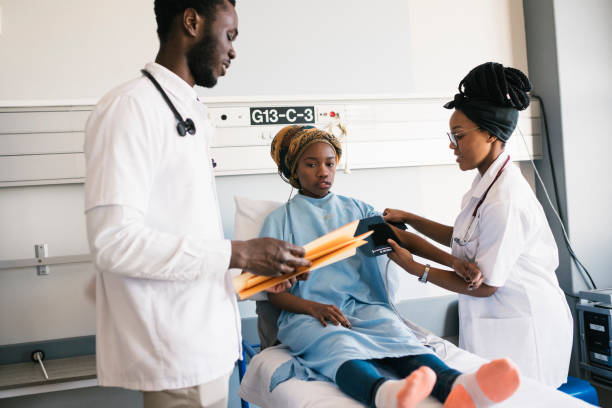 istock Young concerned patient gets her blood pressure checked 1058389936