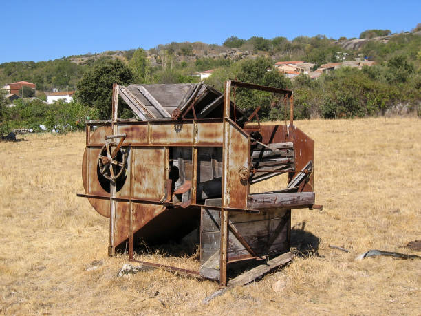 istock Abandoned thresher in the field 1058394152