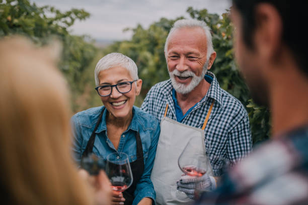 istock Senior couple drinking wine outdoors 1058394322