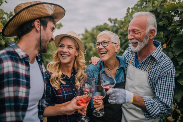 istock Two happy couple drinking wine together 1058394440