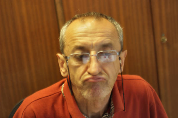 Senior man Librarian among his book