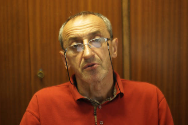 Senior man Librarian among his book