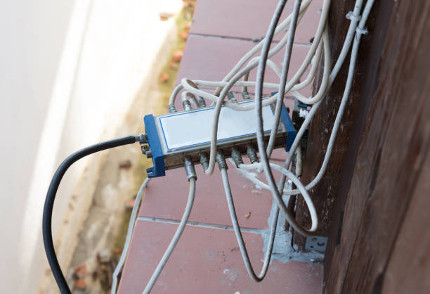 istock Cable television system by wire with cable signal splitter 1058404228