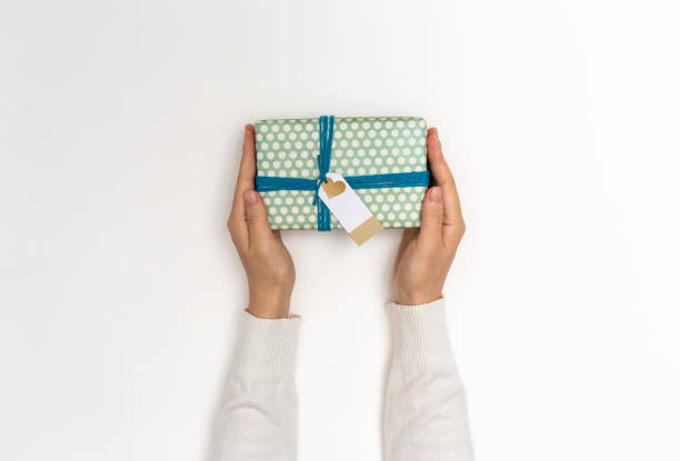 istock Woman holding a gift box 1058408978
