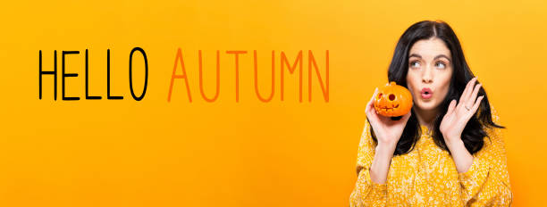 ciao autunno con donna in possesso di una zucca - pumpkin small orange holiday foto e immagini stock
