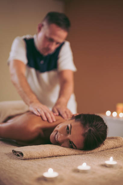 istock Young woman getting shoulder massage from a massage therapist 1058410026