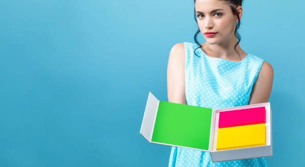 istock Woman with a product display boxes 1058410062