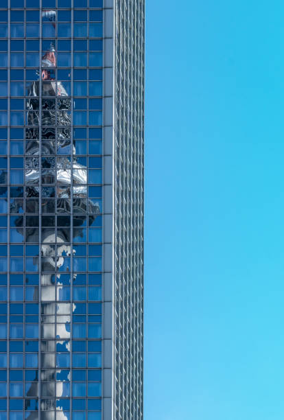 istock Low Angle View Of Modern Buildings Against Clear Blue Sky 1058422006
