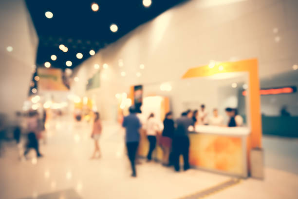 istock Defocused Image Of People In Illuminated Store 1058427418