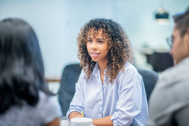istock Creative spunky businesswoman at a meeting 1058428074