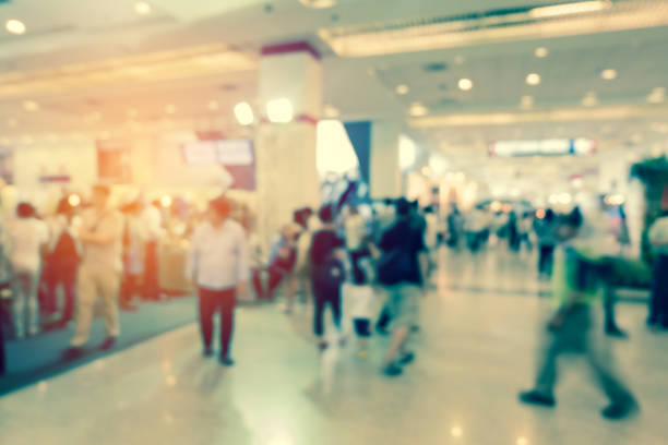 istock Defocused Image Of People Walking At Illuminated Underground Station 1058428126