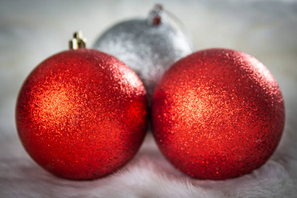 istock Three shiny Christmas balls on the snow 1058430564
