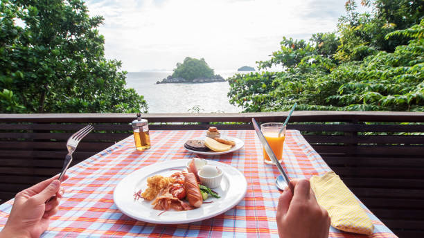 Enjoying Tasty Breakfast On The Sea View Terrace