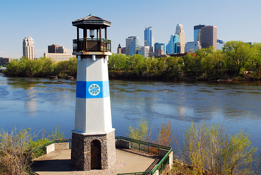 Minneapolis, MN, USA May 14, 2013 The Boom Island Lighthouse stands on a small parcel of land in the Mississippi in Minneapolis, Minnesota,  It serves as a landmark in a city park