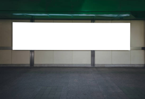 istock big blank billboard white LED screen horizontal outstanding in the city on pathway walking at sky train over the road traffic for display advertisement text template promotion new brand at outdoor. 1058435434