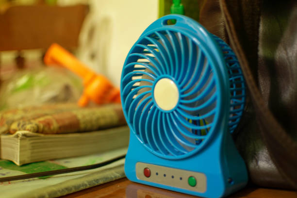 istock Small blue fan And the background is orange. 1058435878