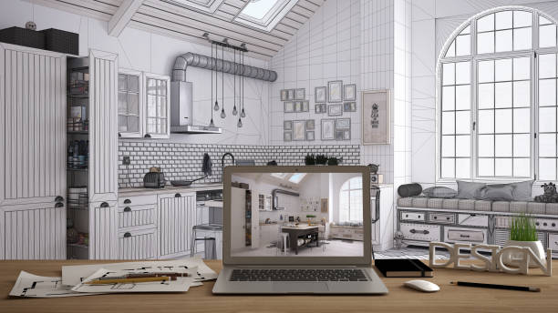 istock Architect designer desktop concept, laptop on wooden work desk with screen showing interior design project, blueprint draft in the background, modern kitchen idea template 1058442660