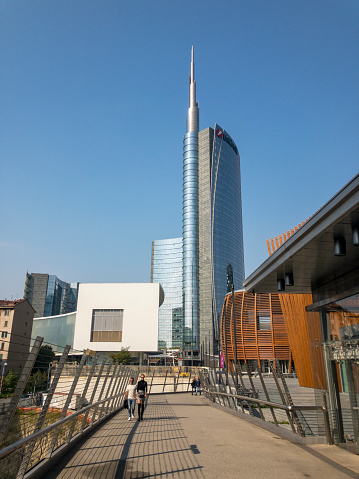 Unicredit tower, Unicredit Pavilion and Coima building seen from the pedestrian bridge at the end of Alvar Aalto square. 10/15/2018. Milan, Italy. Unicredit tower is Italy's tallest skyscraper building