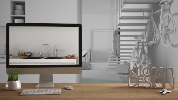 istock Architect designer project concept, wooden table with house keys, 3D letters and desktop showing kitchen with stairs draft, total white sketch in the background, white interior design 1058445440