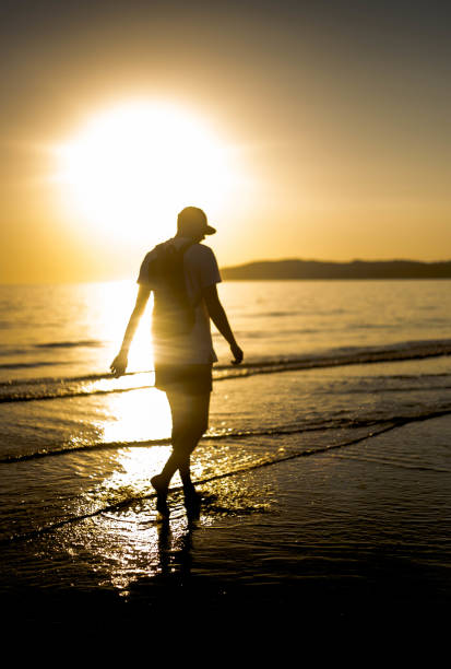 istock Hipster man enjoying the sunset 1058446346