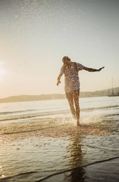 istock Hipster man enjoying the sunset 1058446362
