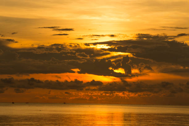 istock Black rain is blocking sunrise in the sea. 1058448290
